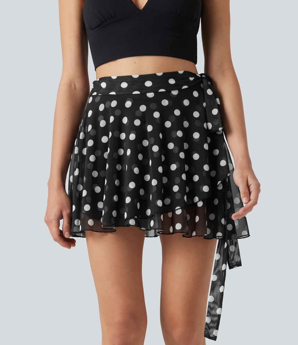 Jupe évasée micro-mini en maille à pois, taille haute, à nouer sur le côté et poche