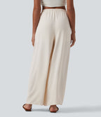 Pantalon large resort taille haute aspect lin avec nœud frontal et poches - Short intégré