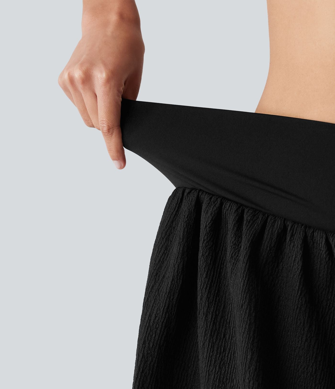 Short de running 2-en-1 taille haute croisée en tissu froissé avec ourlet fendu et poches