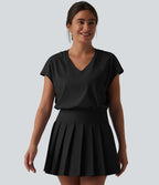 Robe sport de tennis mini 2-en-1 à col V, manches courtes et ourlet plissé avec fermeture éclair invisible et poches