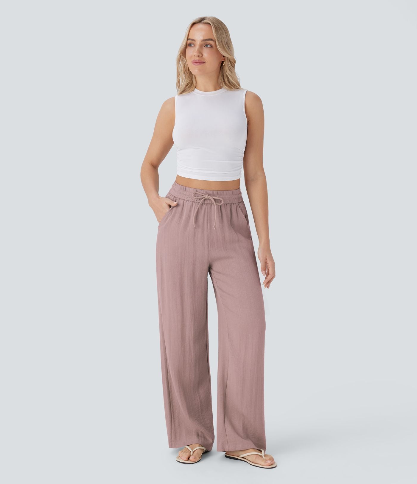 Pantalon large fluide taille haute avec cordon de serrage, poches latérales et aspect lin