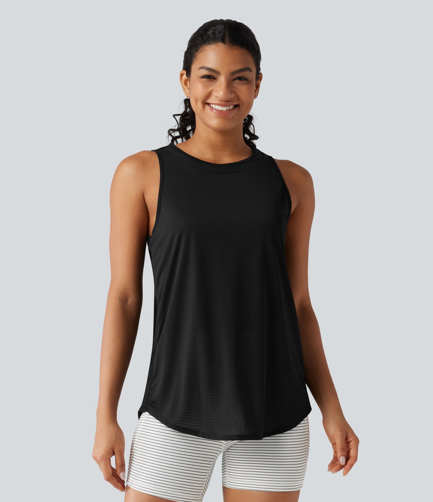 Débardeur de running longueur allongée en mesh contrasté avec ourlet arrondi