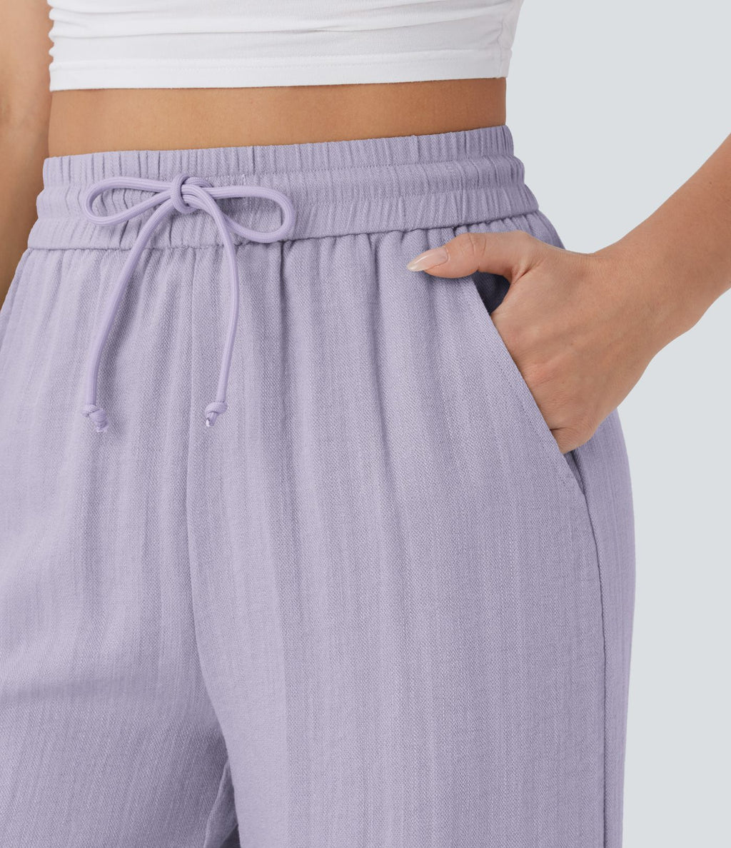 Pantalon large fluide taille haute avec cordon de serrage, poches latérales et aspect lin
