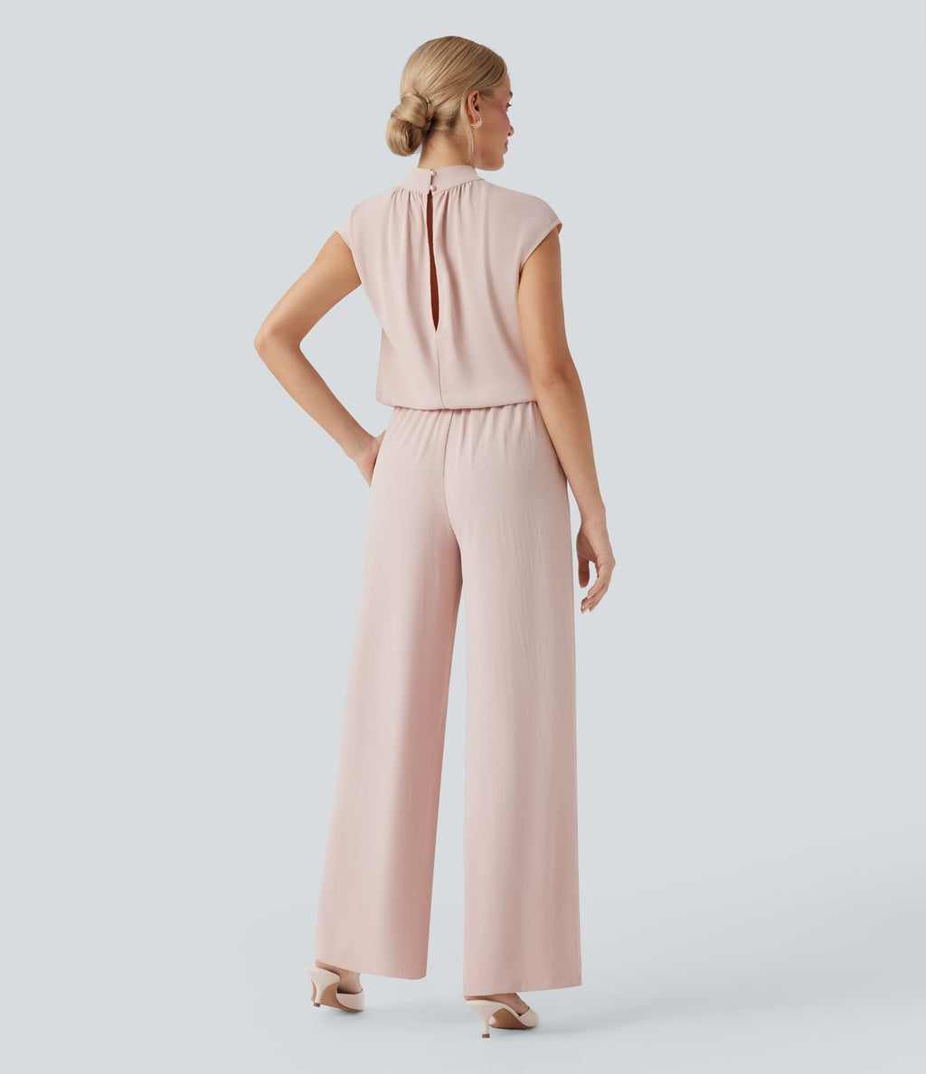 Combinaison pantalon tailleur jambes larges col montant dos goutte d'eau manches courtes avec poches latérales