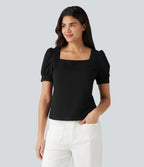 Blouse habillée col carré à manches bouffantes et tissu texturé