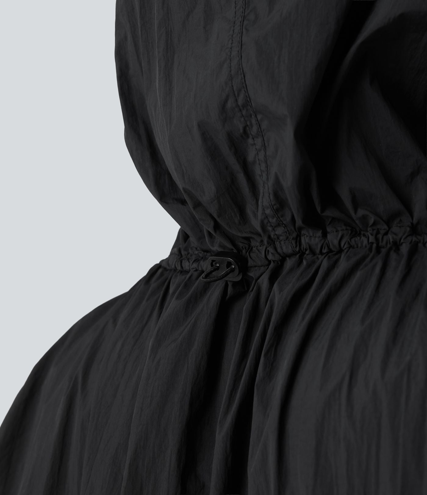 Veste de course légère à capuche manches longues avec poches, cordon de serrage et protection UPF 50+