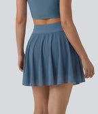 Jupe mini fluide évasée 2-en-1 taille haute à cordon, empiècements en mesh contrastant, avec poche, version plus longue