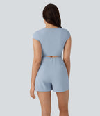 Combinaison de yoga Softlyzero™ Airy avec col U, manches courtes et poches latérales - Édition Easy Peasy