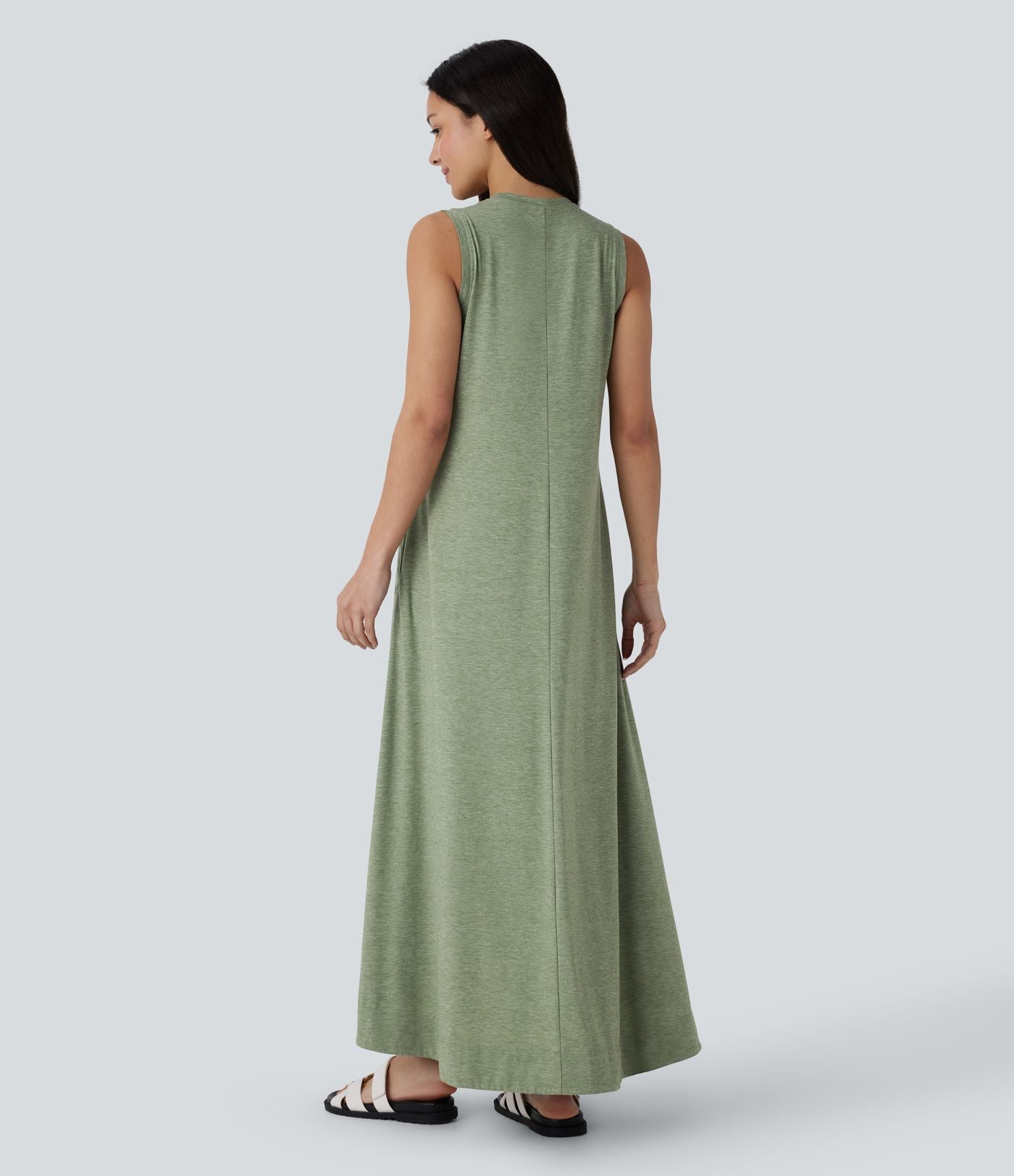 Robe longue décontractée fluide à col rond, sans manches, poches latérales et ourlet asymétrique