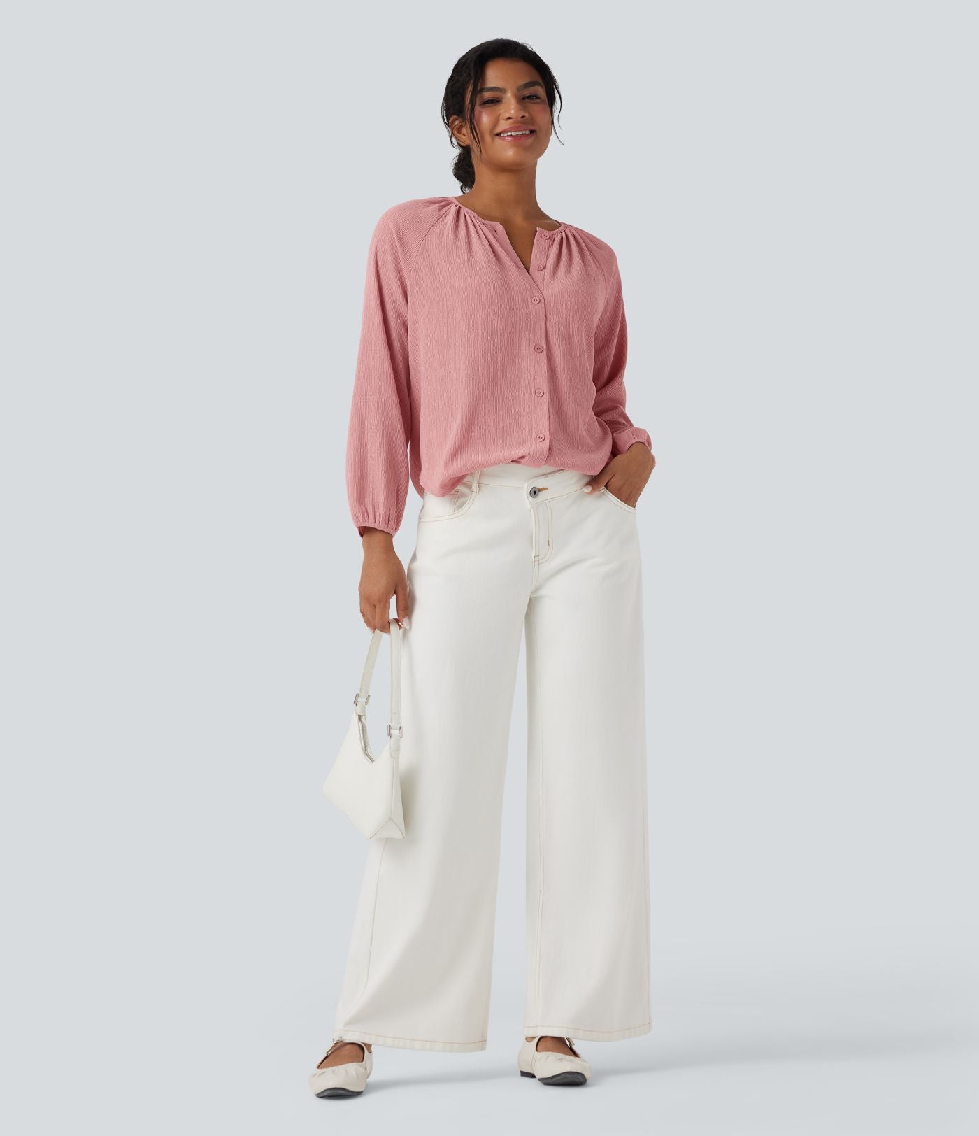 Blouse texturée col rond manches longues ourlet arrondi