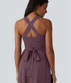Robe midi fluide sans manches décolleté cœur avec bretelles croisées, nœud dans le dos et poches