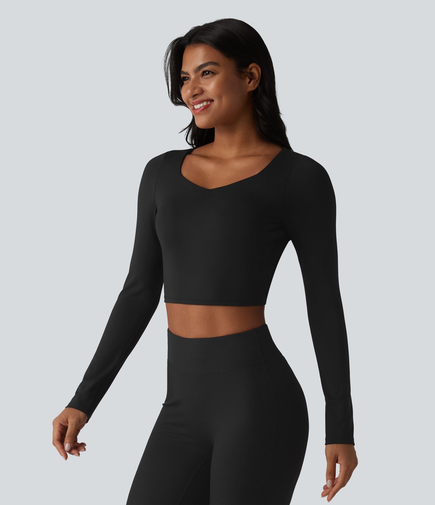 Haut de sport manches longues en mesh respirant avec brassière intégrée
