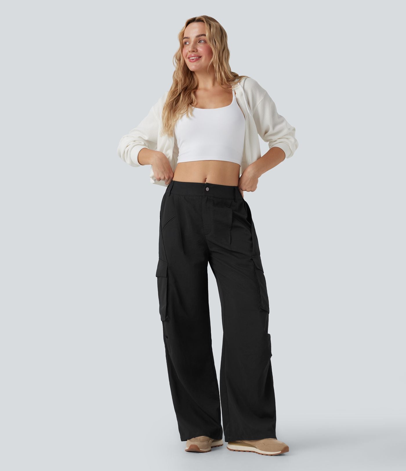 Pantalon cargo décontracté à taille moyenne, jambes larges, boutons, fermeture éclair et poches latérales