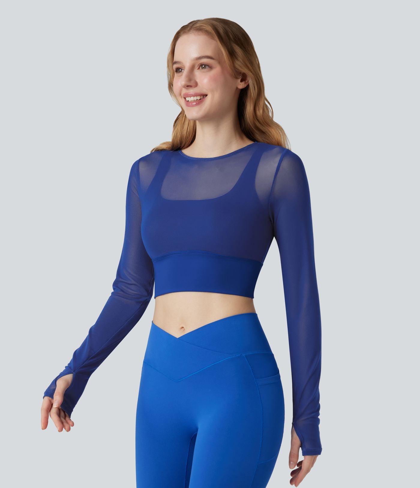 Haut de sport yoga cropped 2-en-1 manches longues mesh contrastant à trous pouces