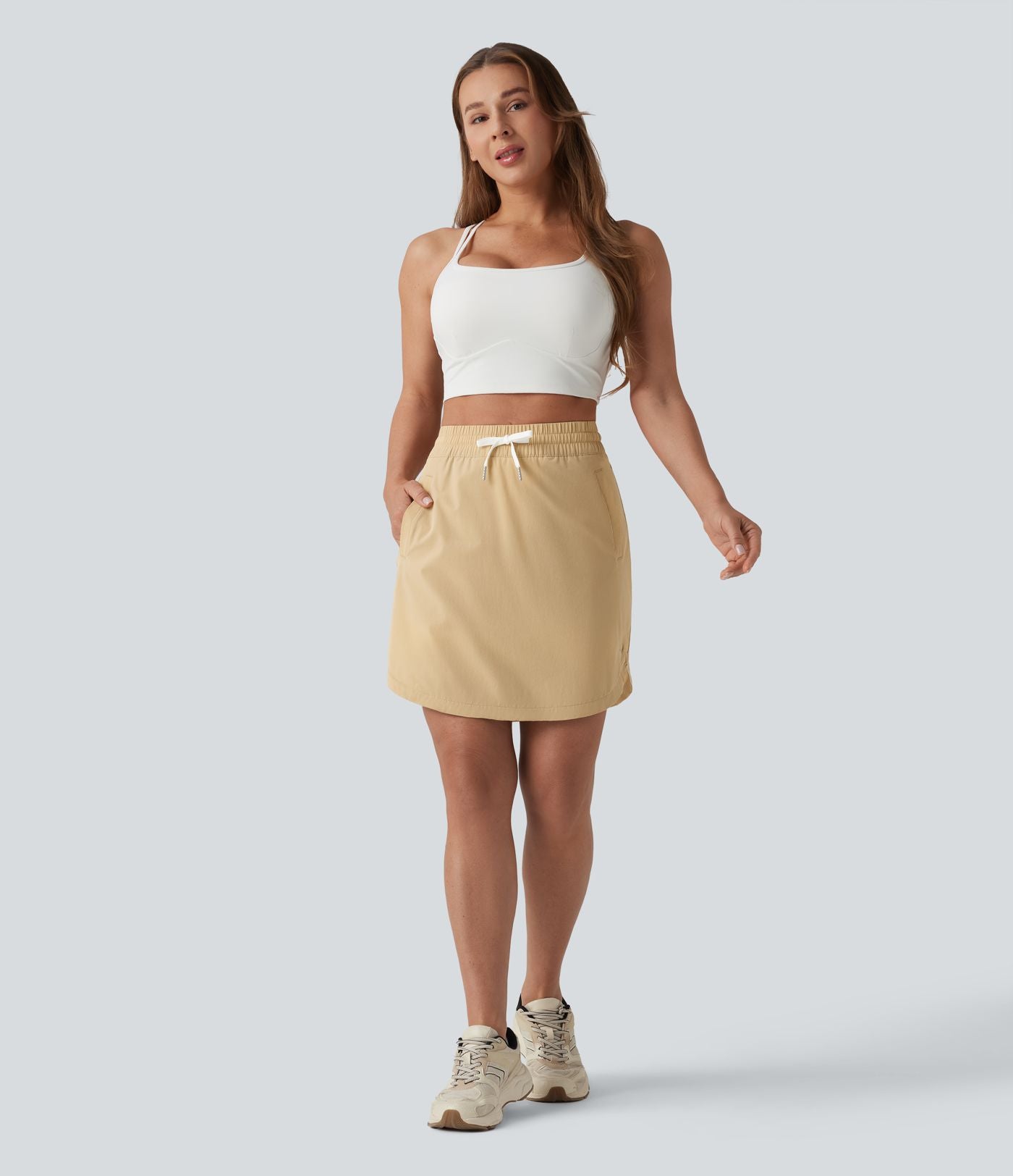 Jupe-short golf mini 2-en-1 taille haute à cordon de serrage et ourlet arrondi avec poches - Longueur plus longue