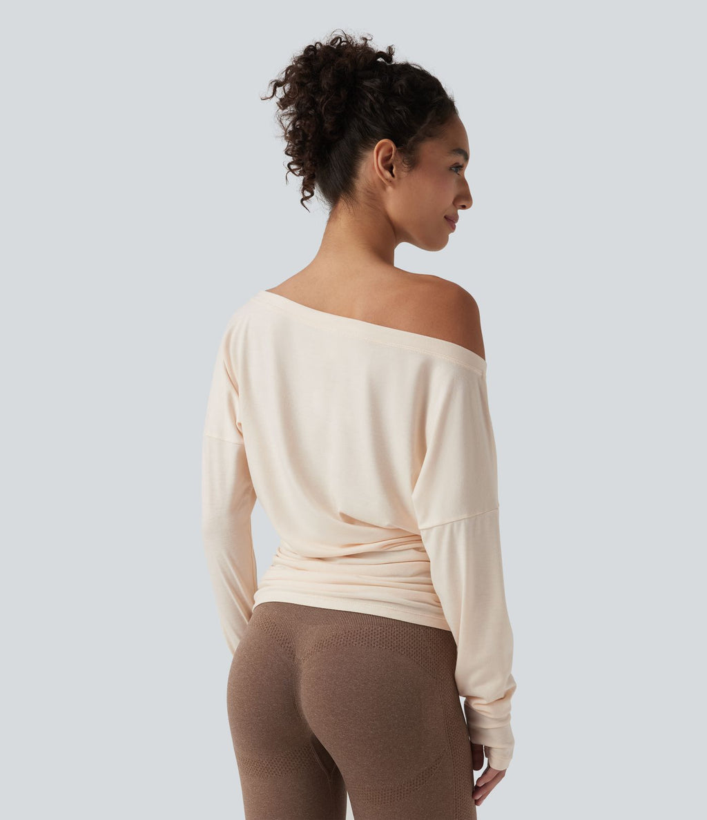 Haut de sport yoga asymétrique manches longues à trous pouces froncé