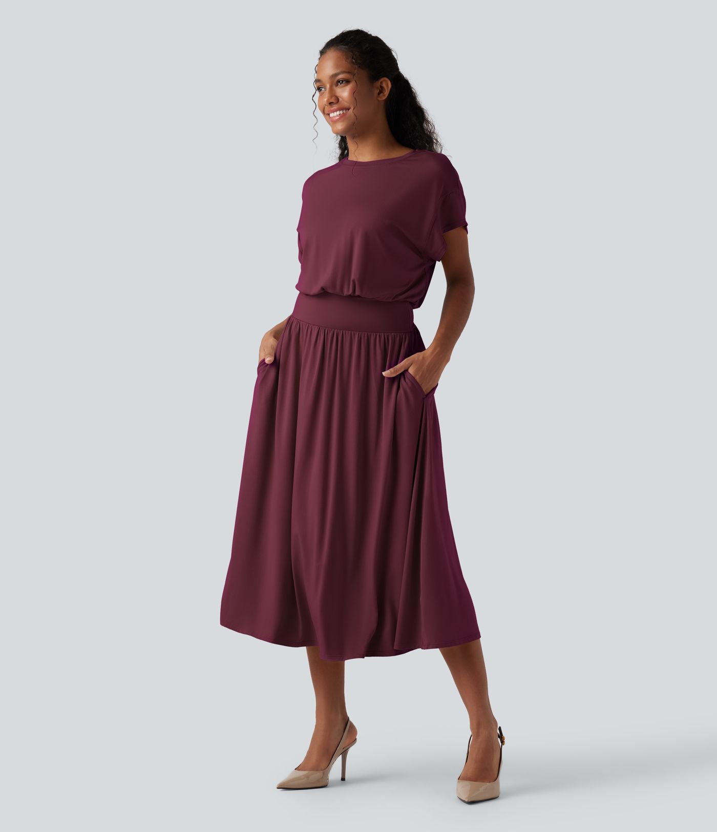 Robe de travail mi-longue fluide gainante à manches chauve-souris avec poches