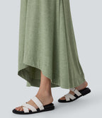 Robe longue décontractée fluide à col rond, sans manches, poches latérales et ourlet asymétrique