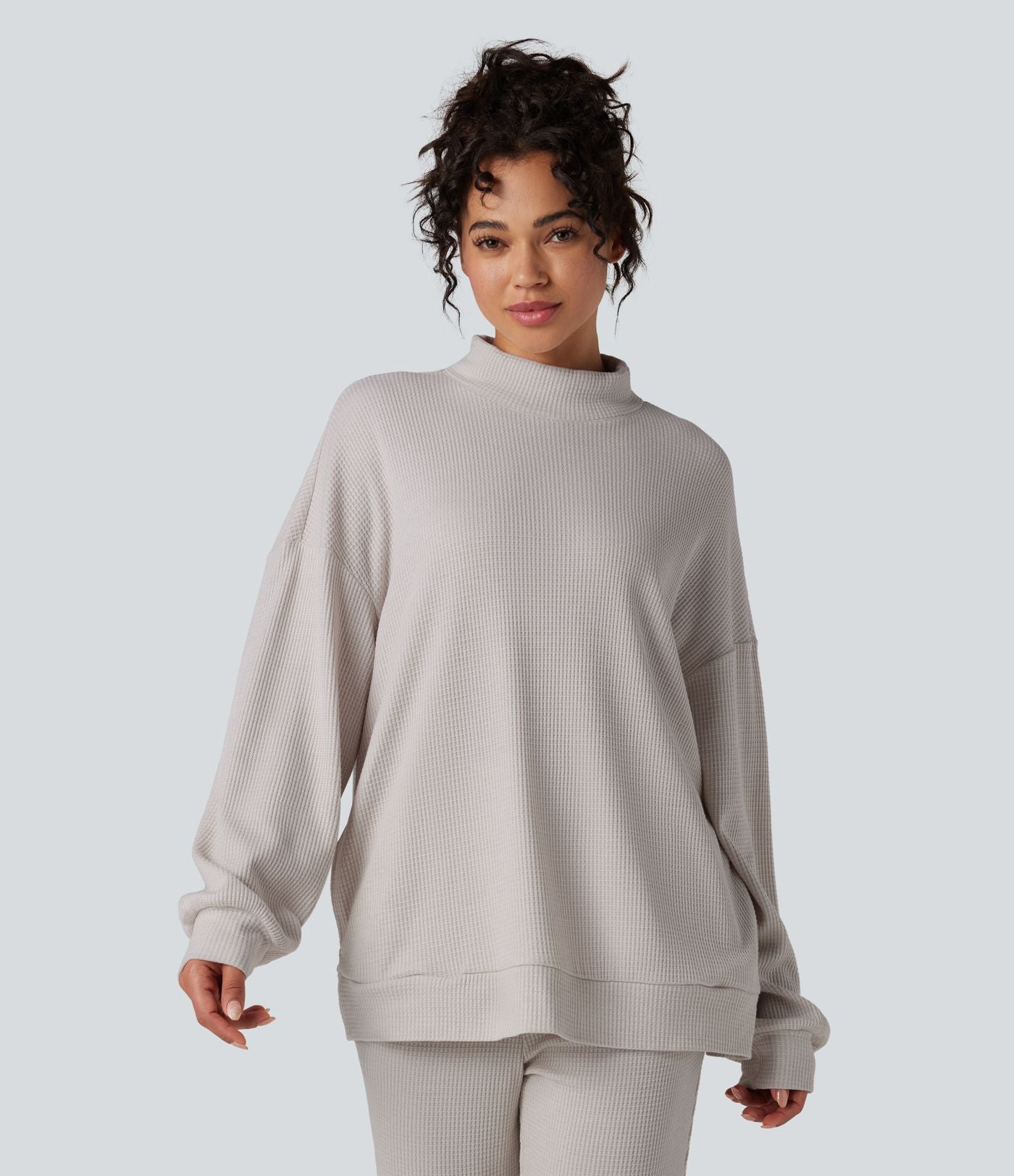Sweat-shirt gaufré col montant manches longues coupe décontractée avec poches