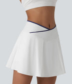 Jupe de tennis mini 2-en-1 color block croisée taille mi-haute avec poches