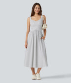 Robe fluide décontractée midi sans manches dos nu croisée à pois avec poches