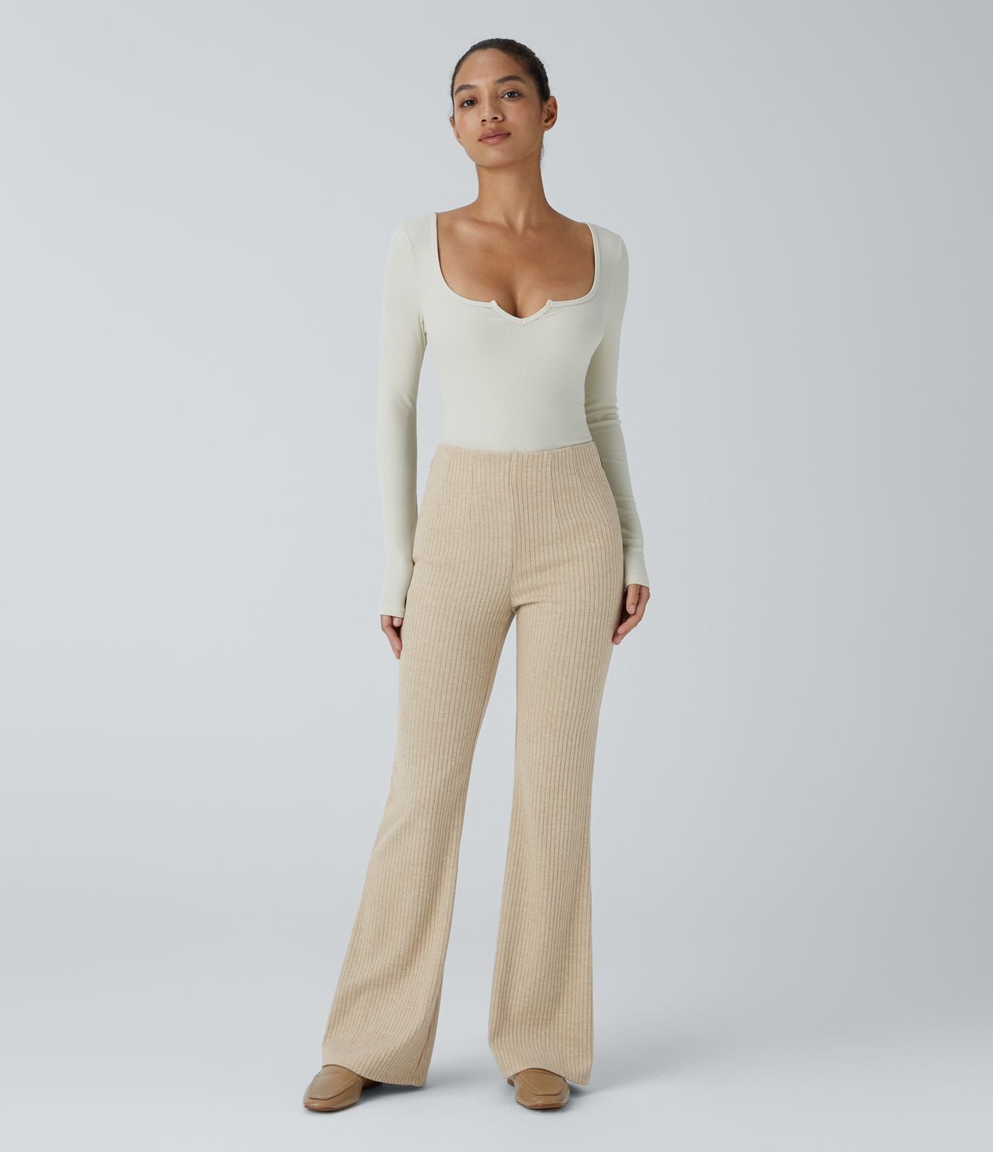 Pantalon décontracté évasé en maille côtelée à taille haute et poches zippées latérales