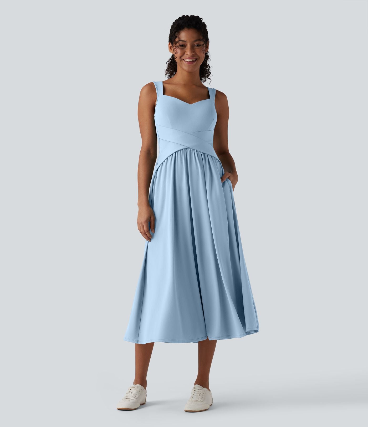 Robe midi fluide sans manches dos croisé ouvert avec poches