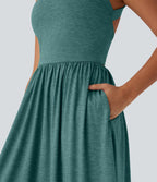 Robe longue fluide fendue avec poches latérales, dos nu et effet torsadé