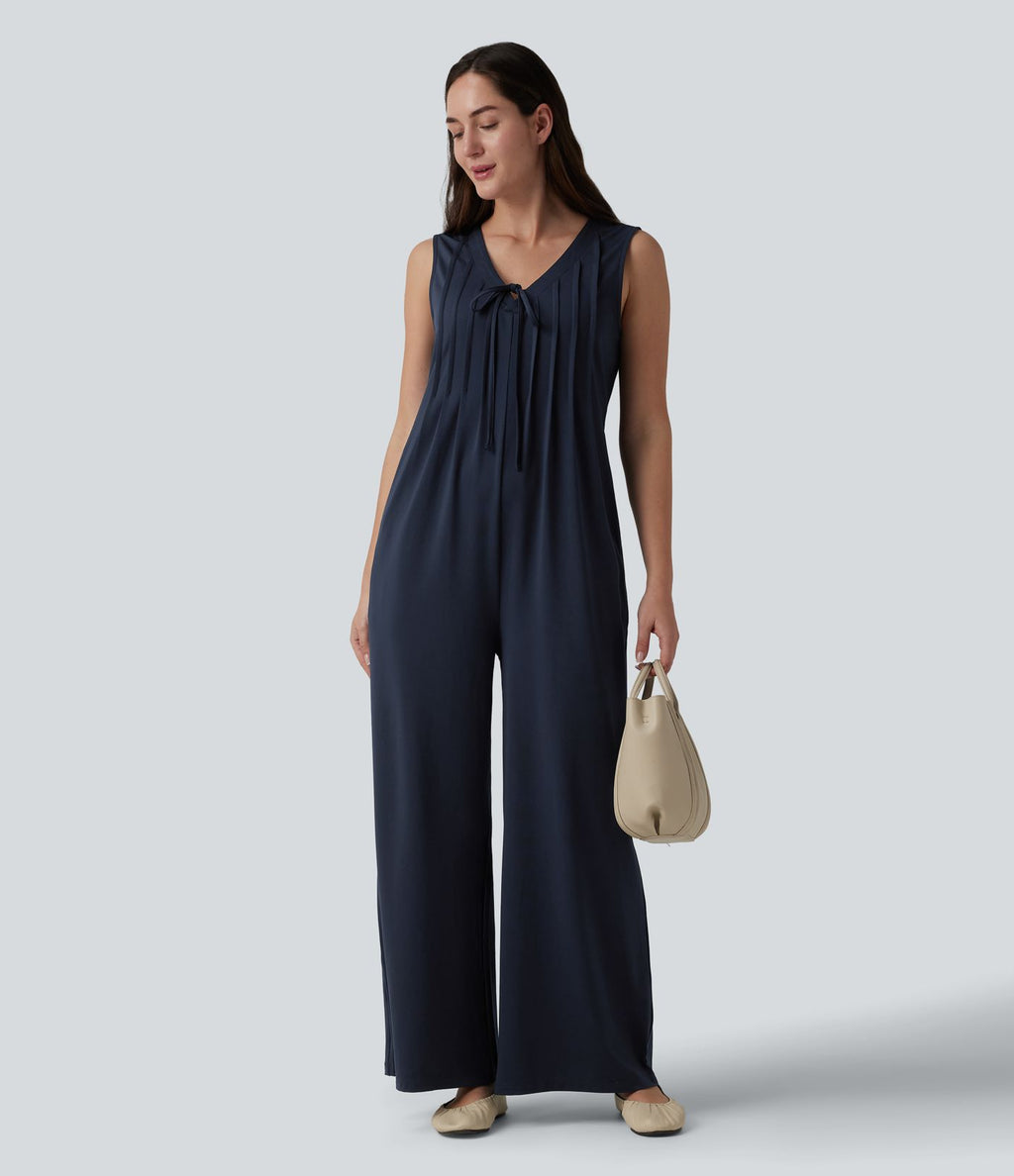 Combinaison casual ample décolleté plongeant sans manches plissée à nœud devant et fermeture éclair invisible avec poches