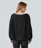 Sweat-shirt décolleté bateau à manches longues ourlet asymétrique