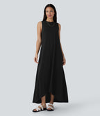 Robe longue décontractée fluide à col rond, sans manches, poches latérales et ourlet asymétrique