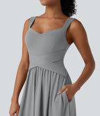 Robe midi fluide sans manches dos croisé ouvert avec poches
