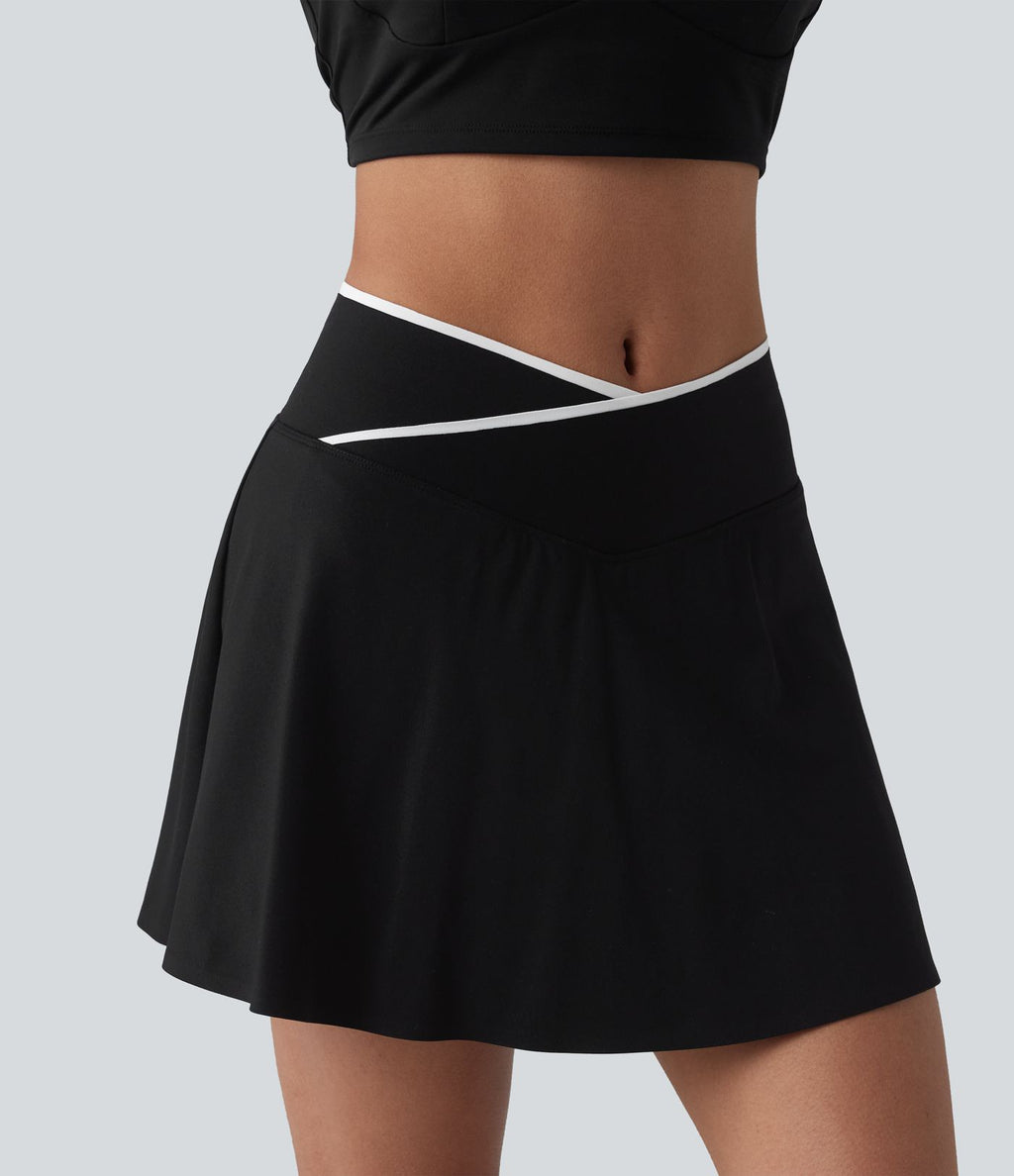Jupe de tennis mini 2-en-1 color block croisée taille mi-haute avec poches
