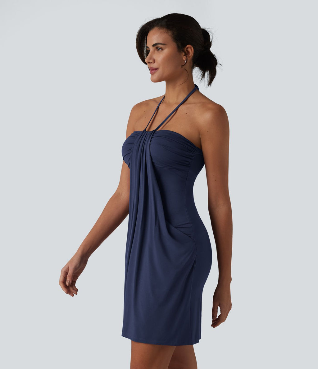 Robe resort mini dos nu à col licou avec lien noué dans le dos et poches