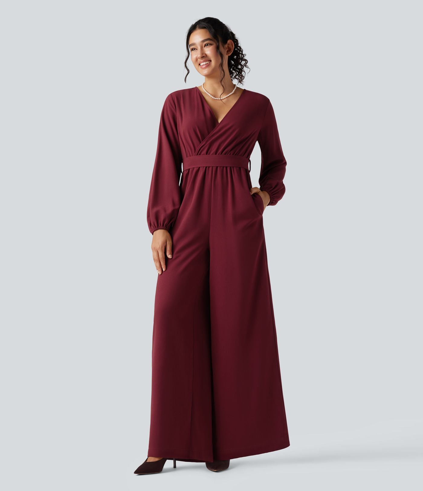 Combinaison pantalon de soirée large à décolleté en V, manches longues bouffantes, ceinture et poches