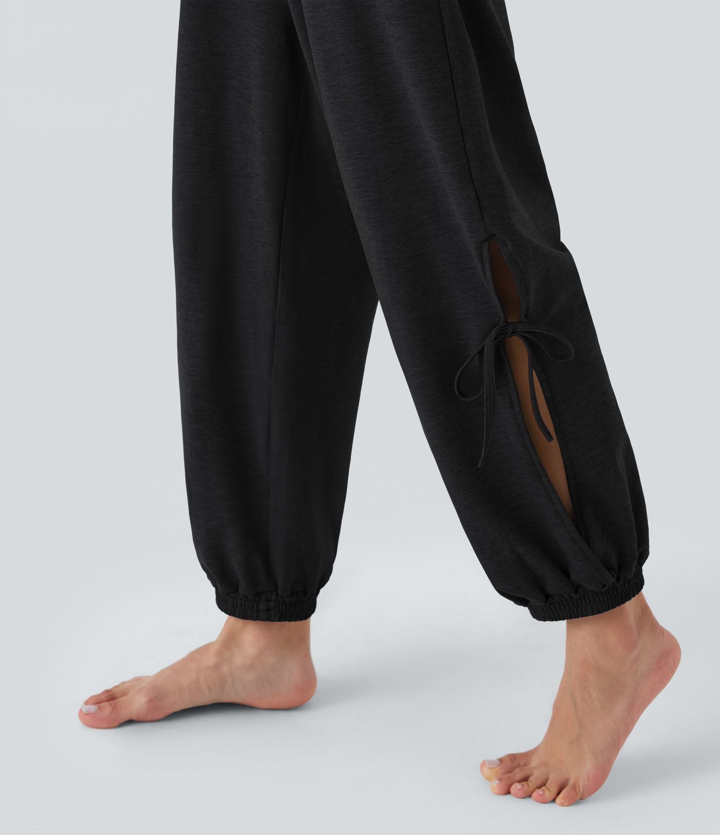 Combinaison de yoga sans manches dos nu à découpes avec cordon de serrage et poches