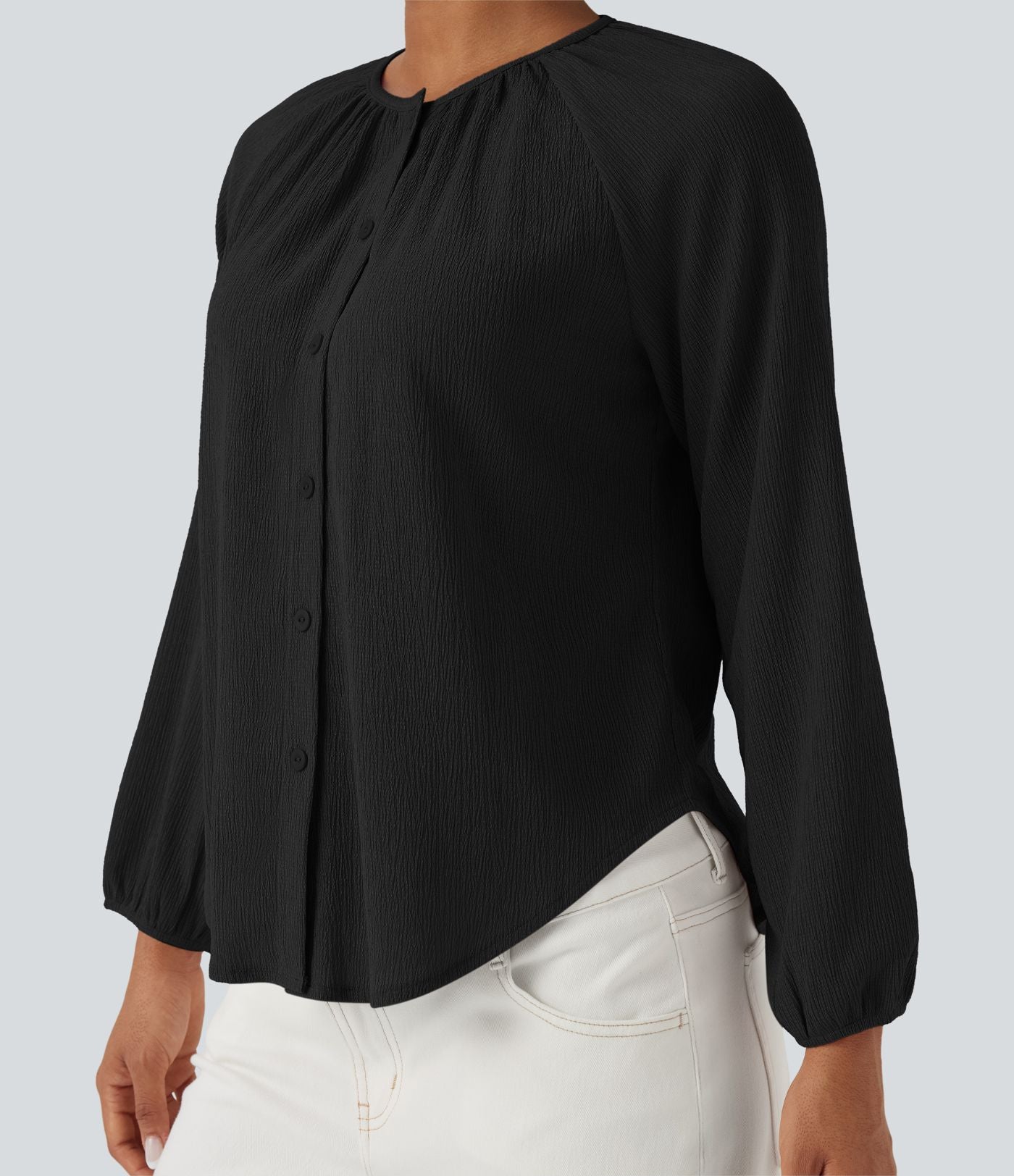 Blouse texturée col rond manches longues ourlet arrondi