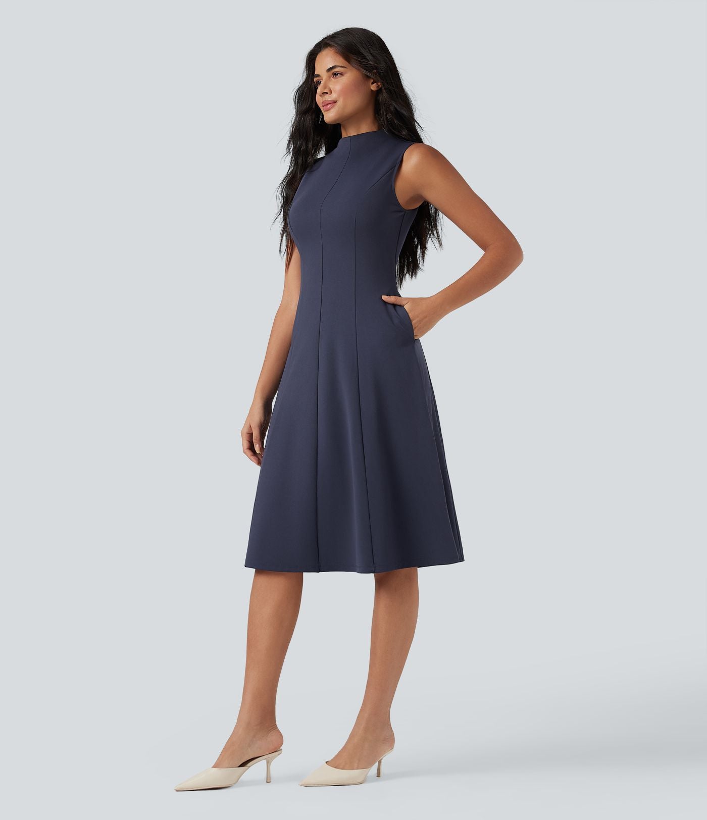 Robe mi-longue col montant sans manches avec poches