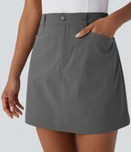 Jupe courte de golf ligne A taille haute avec boutons, zip, poches latérales et fente