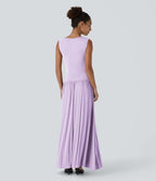 Robe longue à encolure bateau, bretelles asymétriques, côtés froncés et poches
