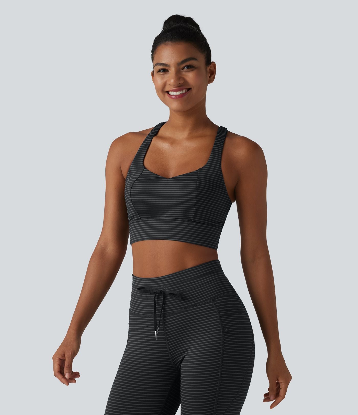 Brassière de sport yoga à rayures dos nageur croisé maintien léger avec soutien-gorge intégré