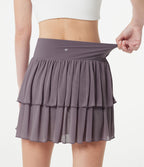 Jupe-short tennis mini fluide taille haute croisée en mesh à volants, avec poches