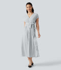 Robe midi à pois col V avec manches courtes, lien côté et poches