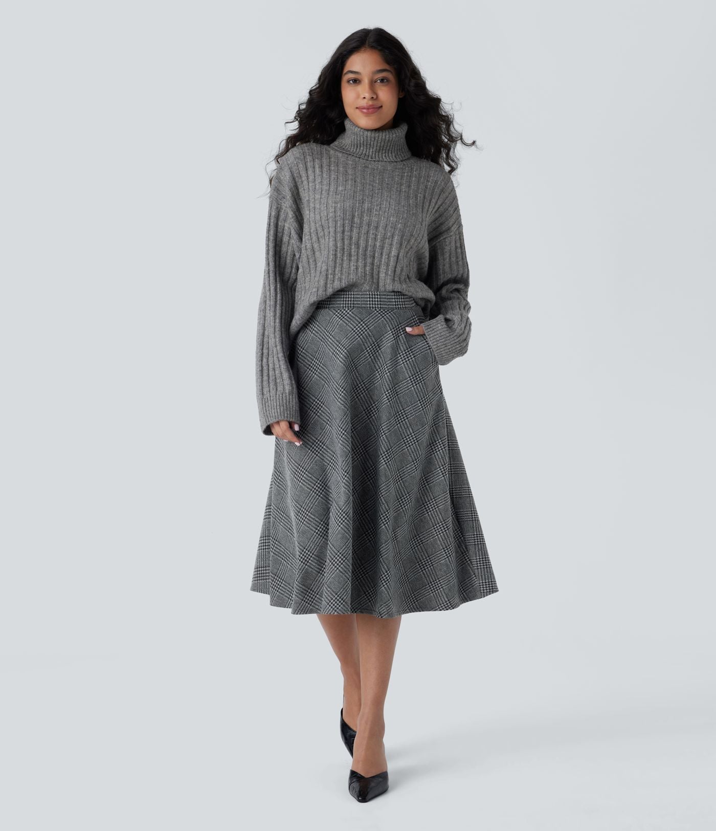 Jupe midi évasée à taille haute et poches latérales, motif pied-de-poule