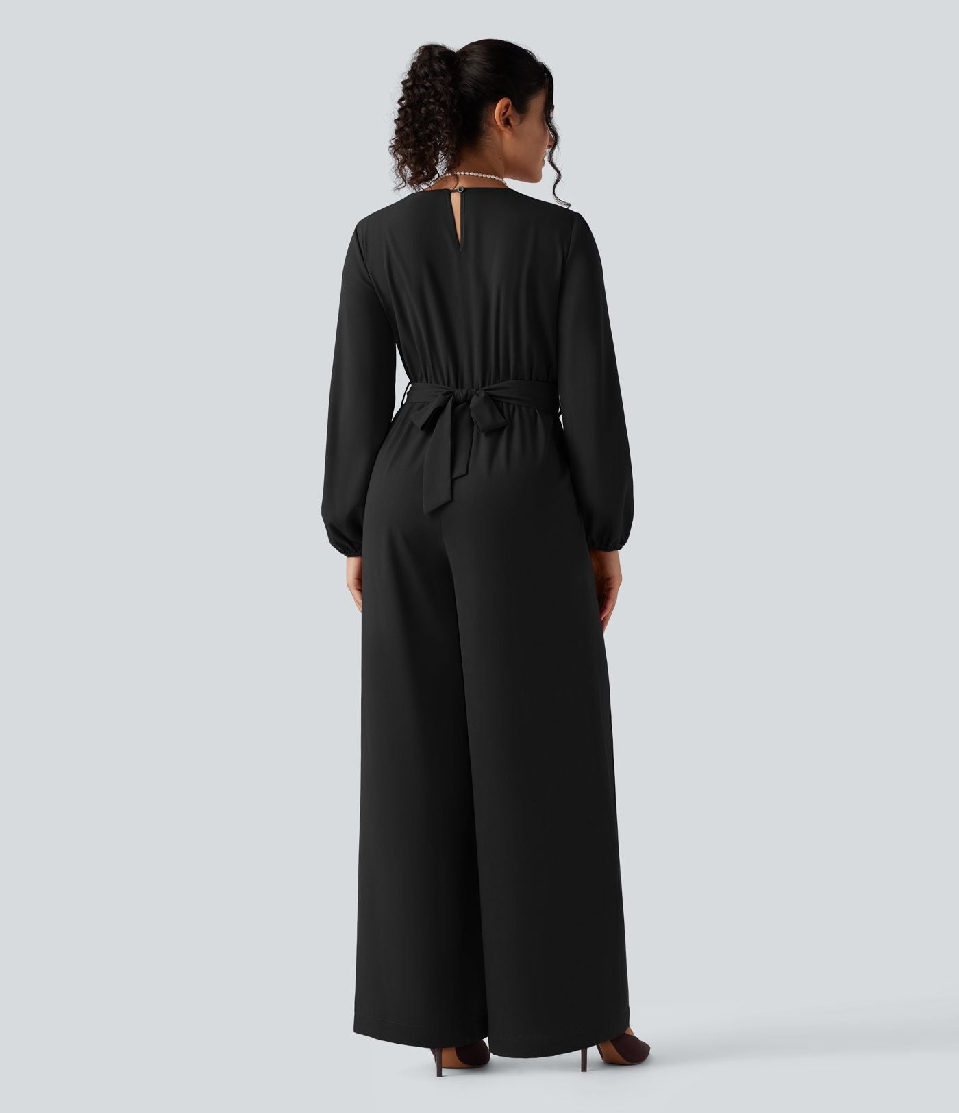 Combinaison pantalon de soirée large à décolleté en V, manches longues bouffantes, ceinture et poches