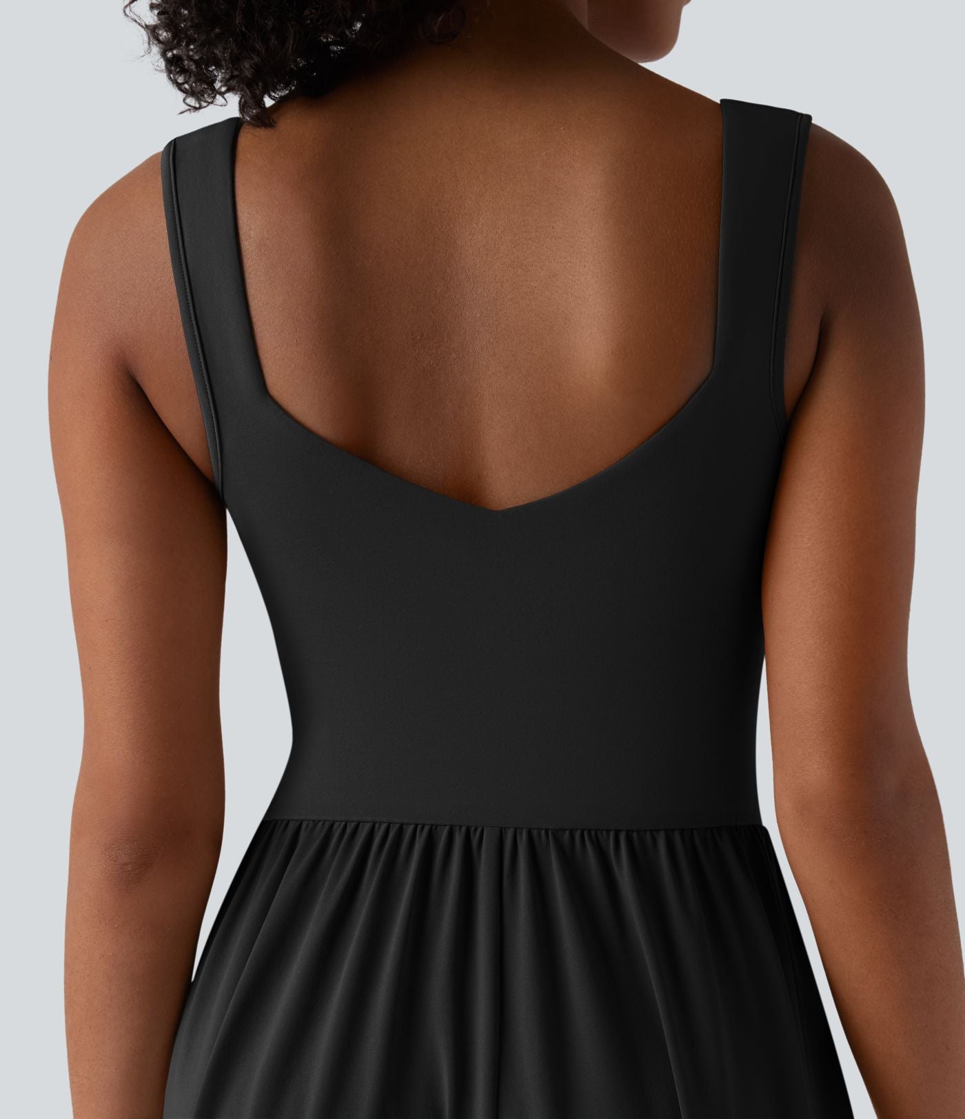 Robe midi fluide sans manches dos croisé ouvert avec poches