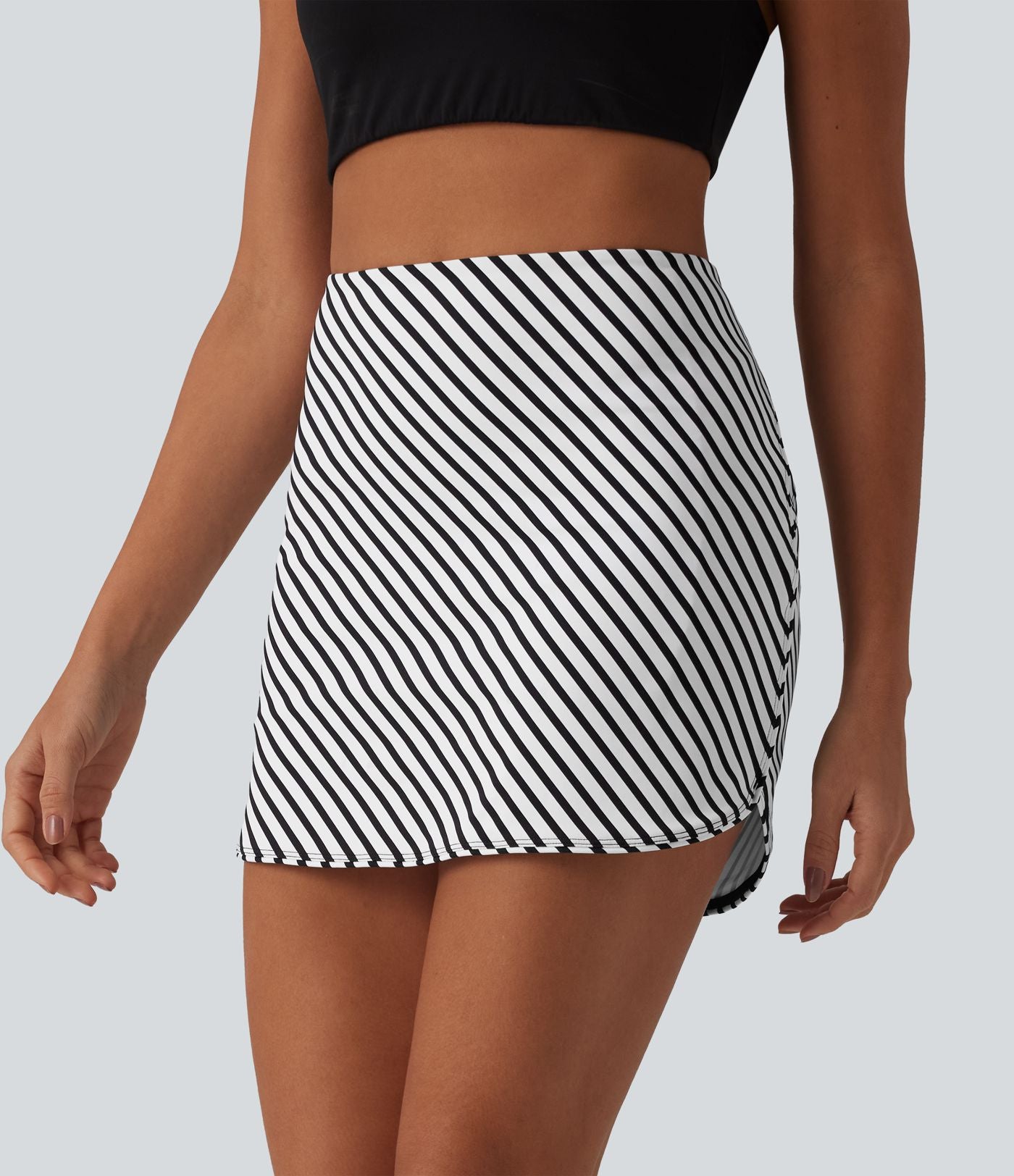 Jupe mini de tennis 2-en-1 à rayures taille haute avec ourlet arrondi et poches