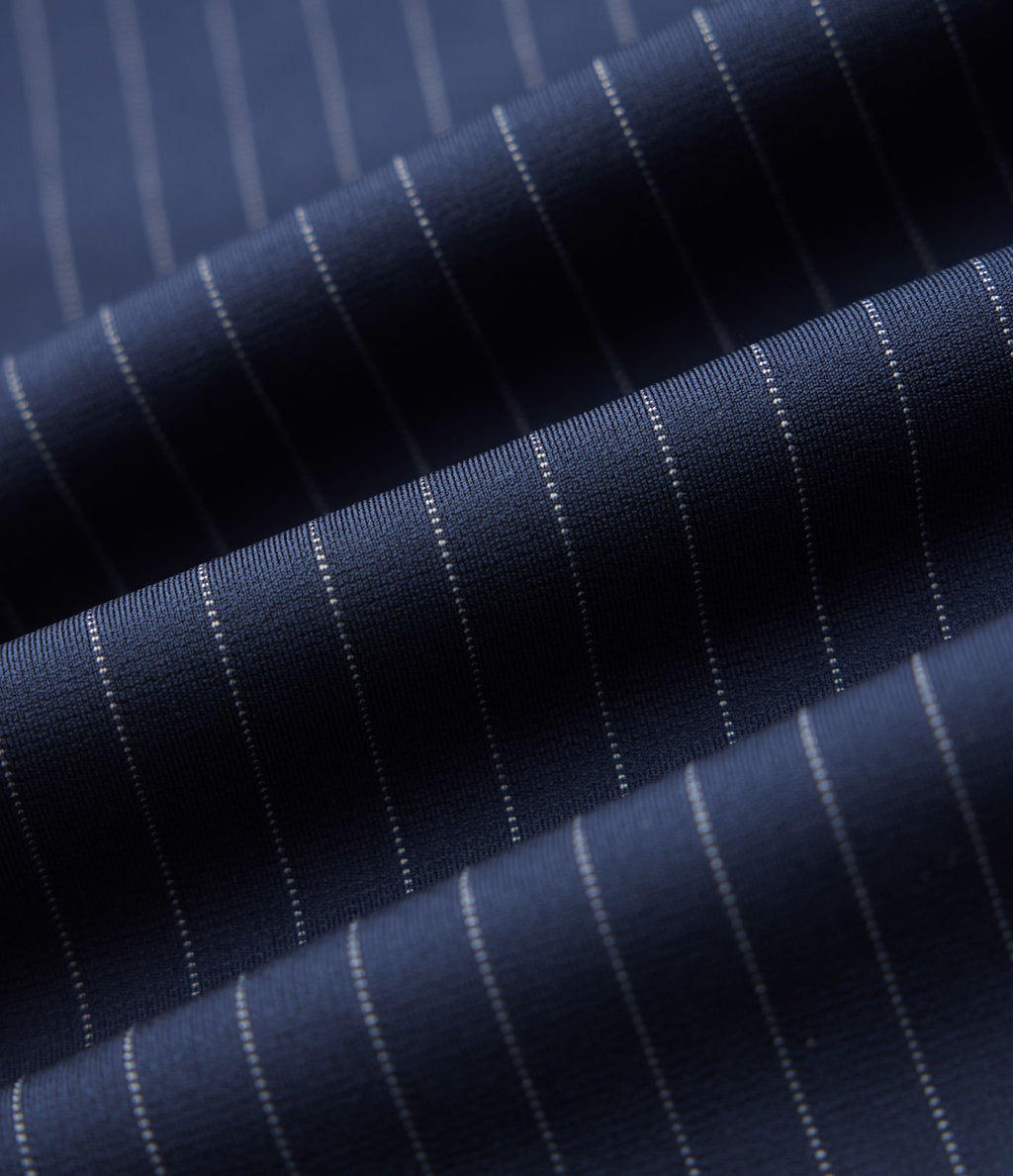 Pantalon tailleur fuselé 7/8 taille haute à rayures avec poches