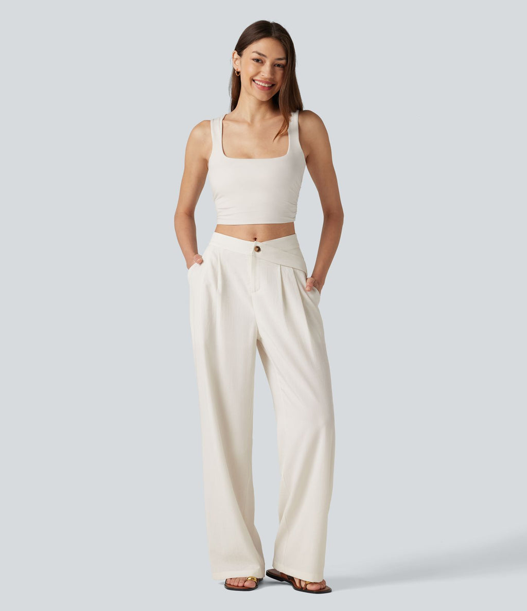Pantalon large fluide asymétrique taille mi-haute plissé avec poches et aspect lin