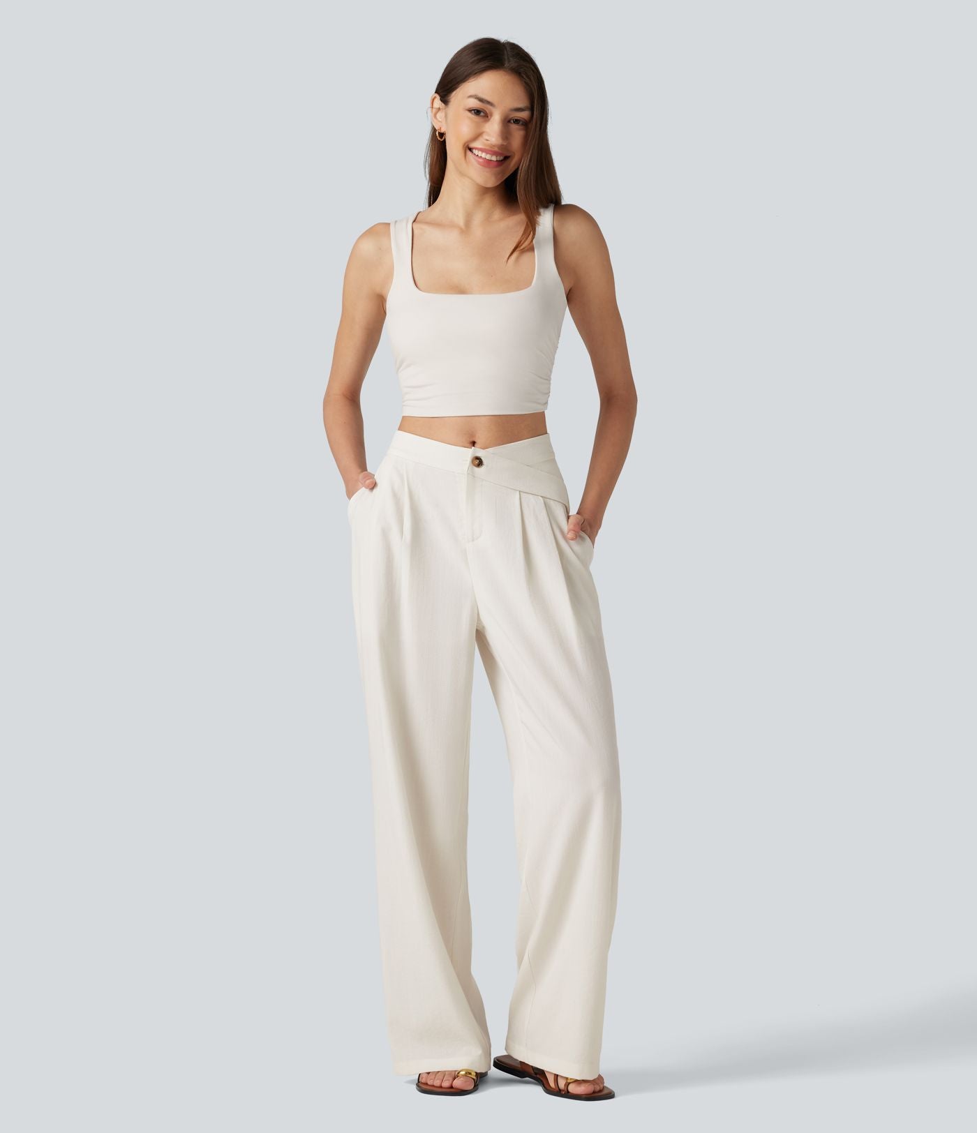 Pantalon large fluide asymétrique taille mi-haute plissé avec poches et aspect lin